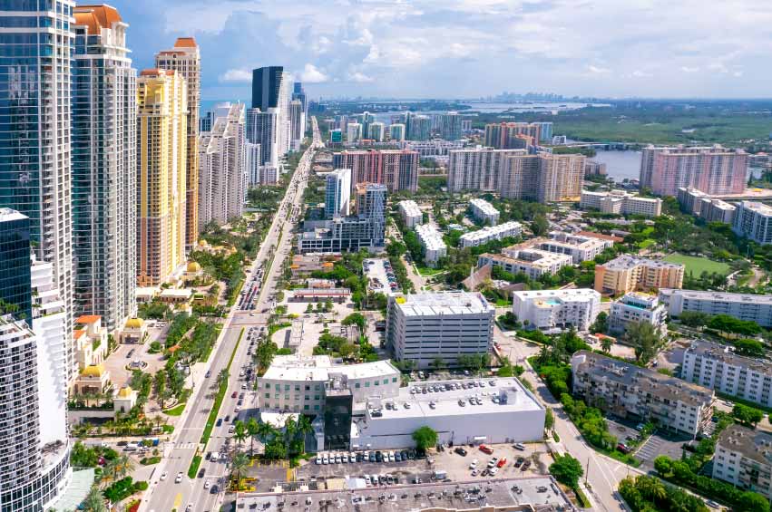 Palm-lined neighborhood street and homes in Plantation, Florida