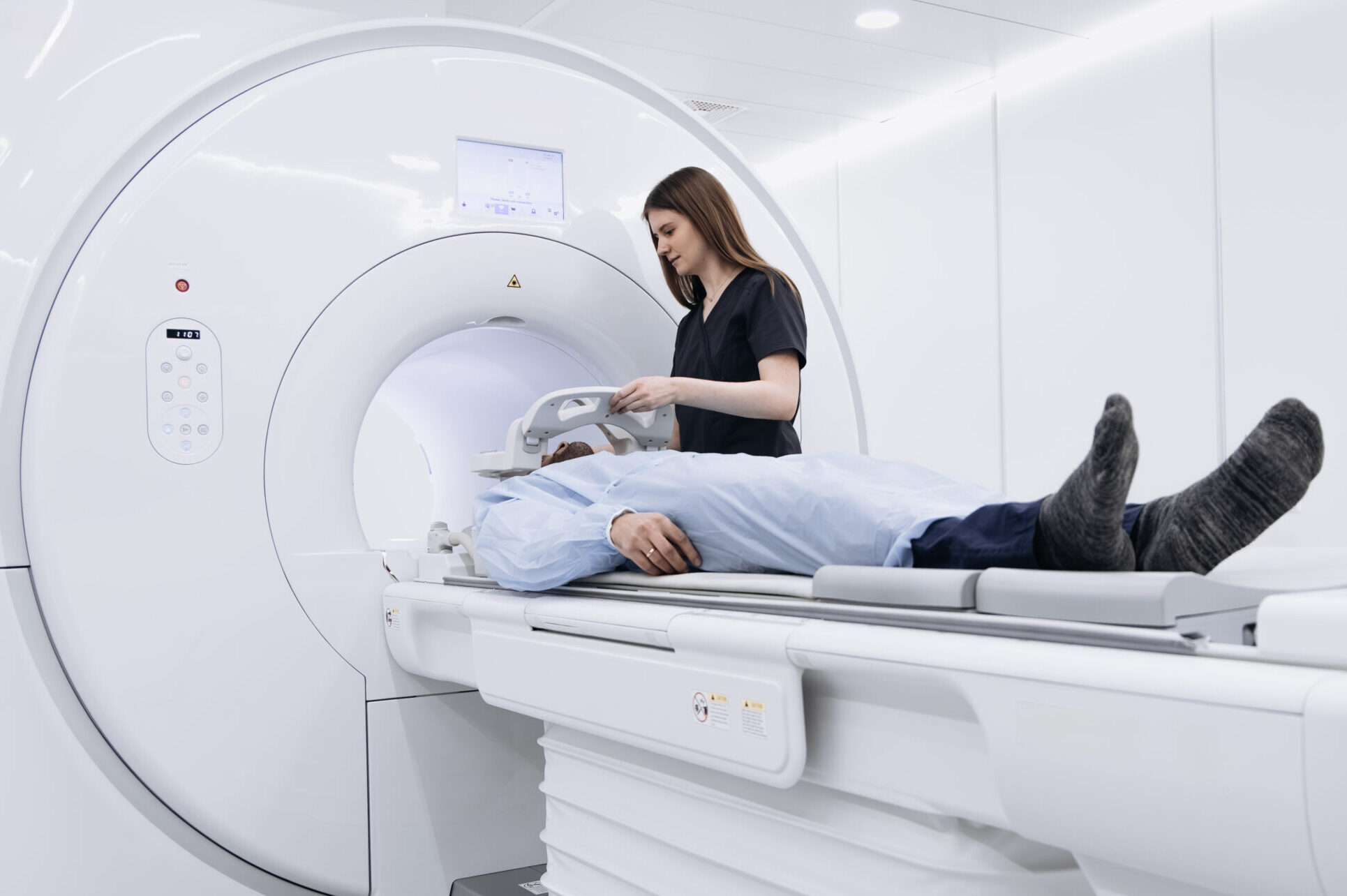 Patient lies on MRI machine